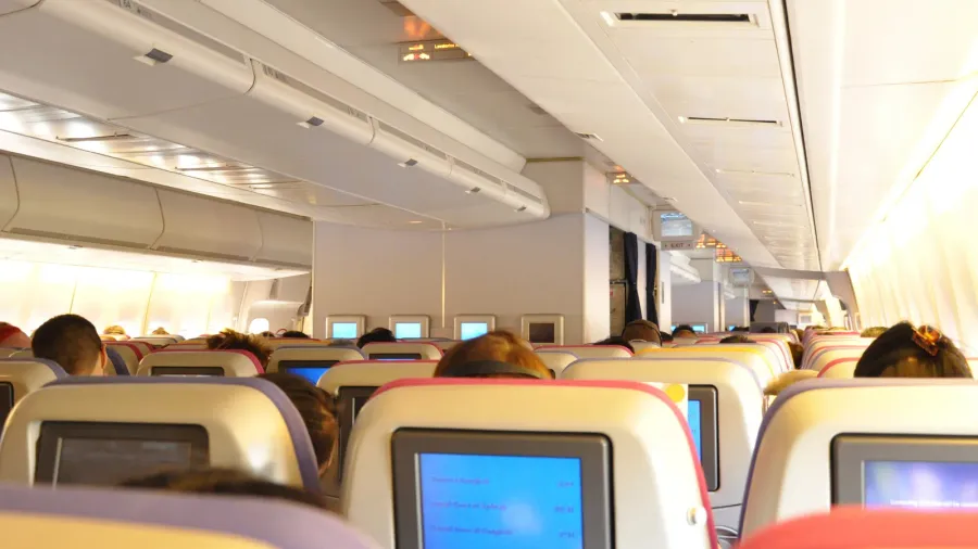 aircraft cabin interior with passengers