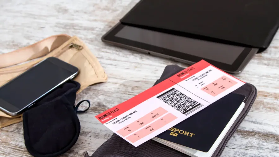 airline ticket passport and electronics
