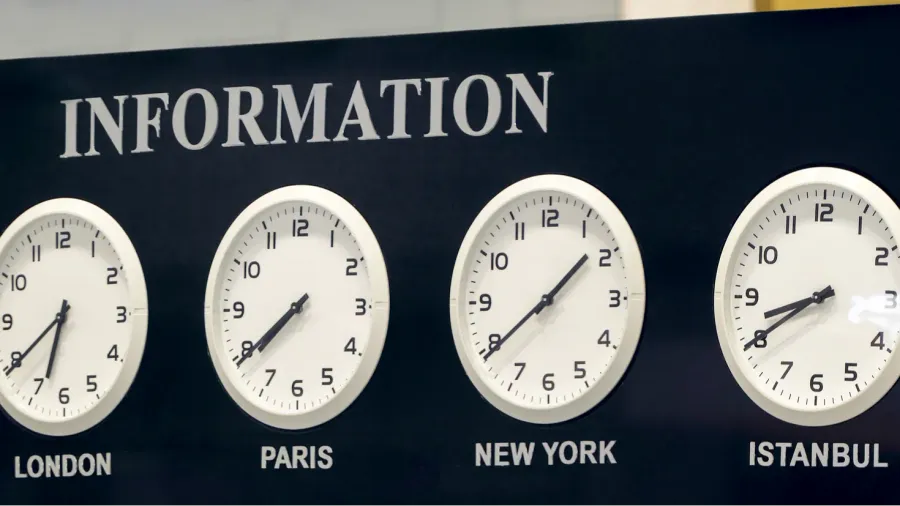 airport information desk with time zone clocks