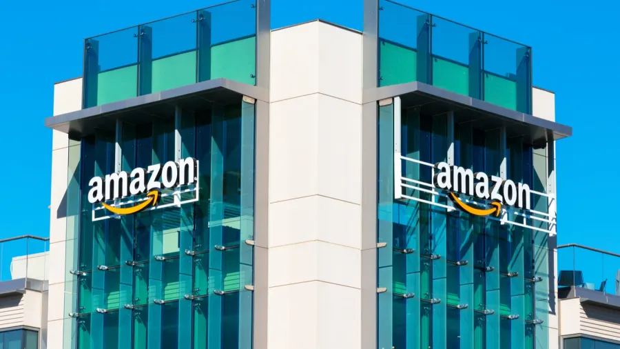 amazon logo with its signature orange smile on the glass