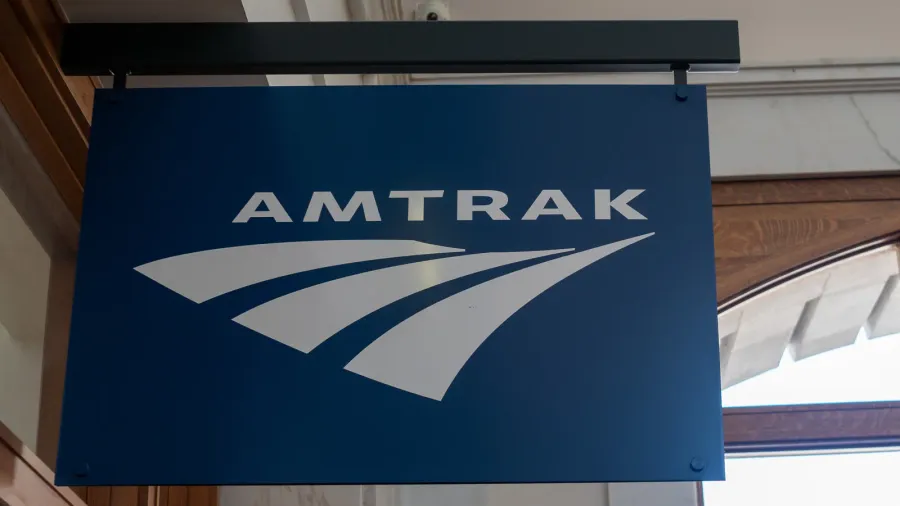 amtrak sign hanging outside of terminal location