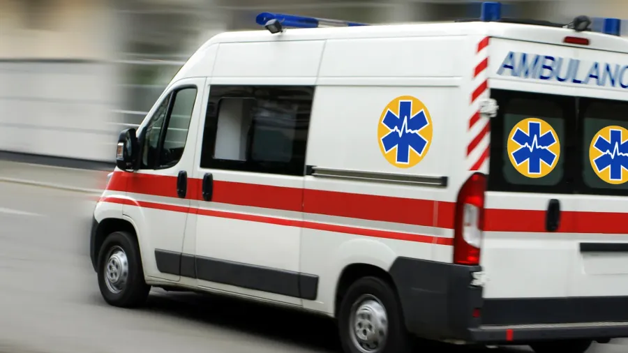 an ambulance is driving down the street