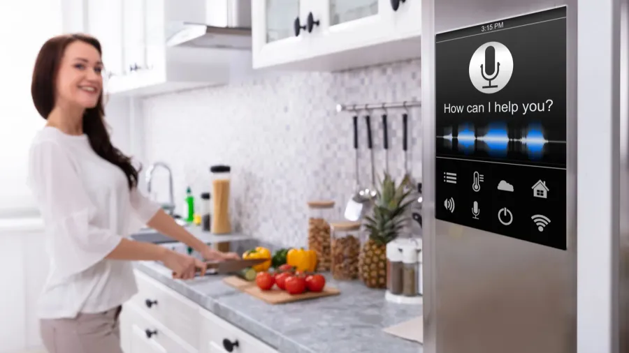 an oven with voice recognition function near smiling young woman