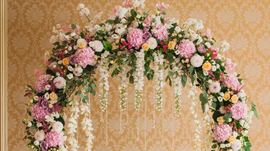 archway decorated with colorful flowers