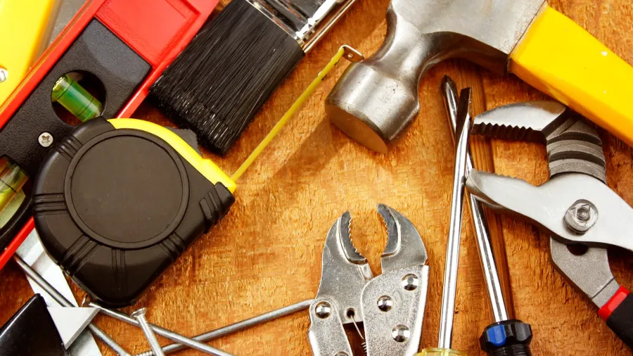assorted work tools on wood