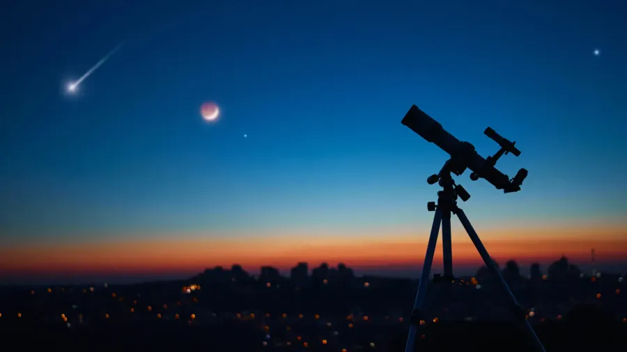 astronomical telescope under a twilight sky ready for stargazing