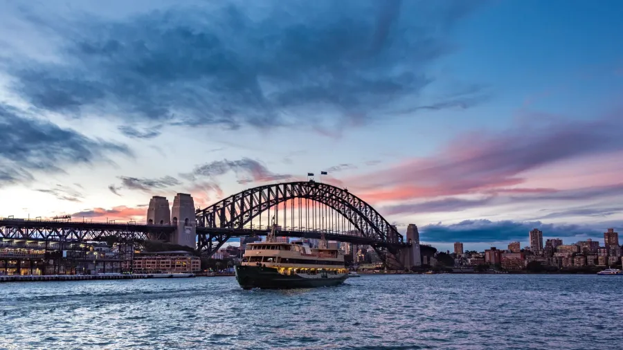 australian iconic landmark sydney harbour bridge against picturesque sunset sky