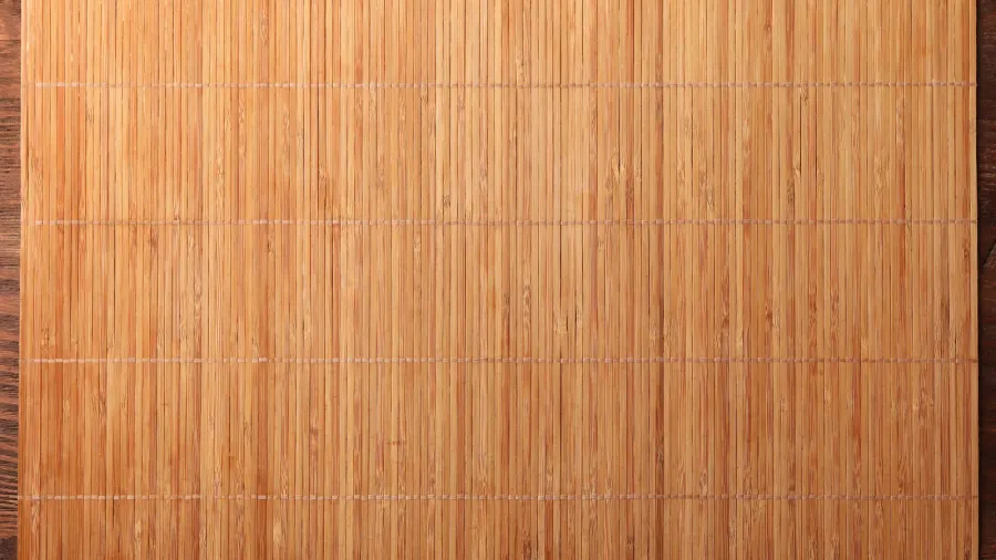 bamboo mat on wooden table top view space for text