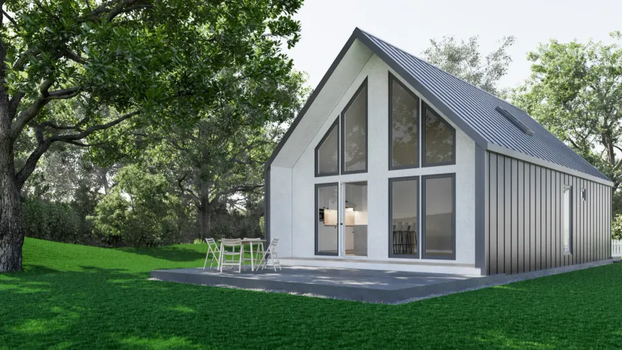 Modern house with large, angled windows and white exterior surrounded by trees.