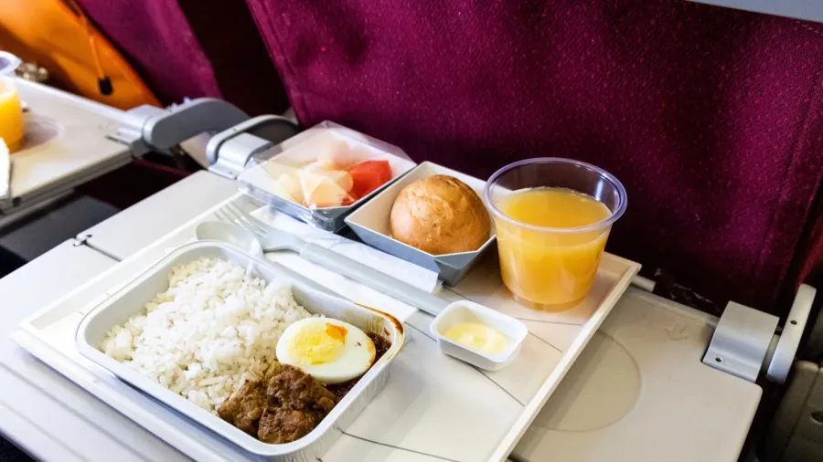 basic inflight meal of economy class consisting rice egg beef