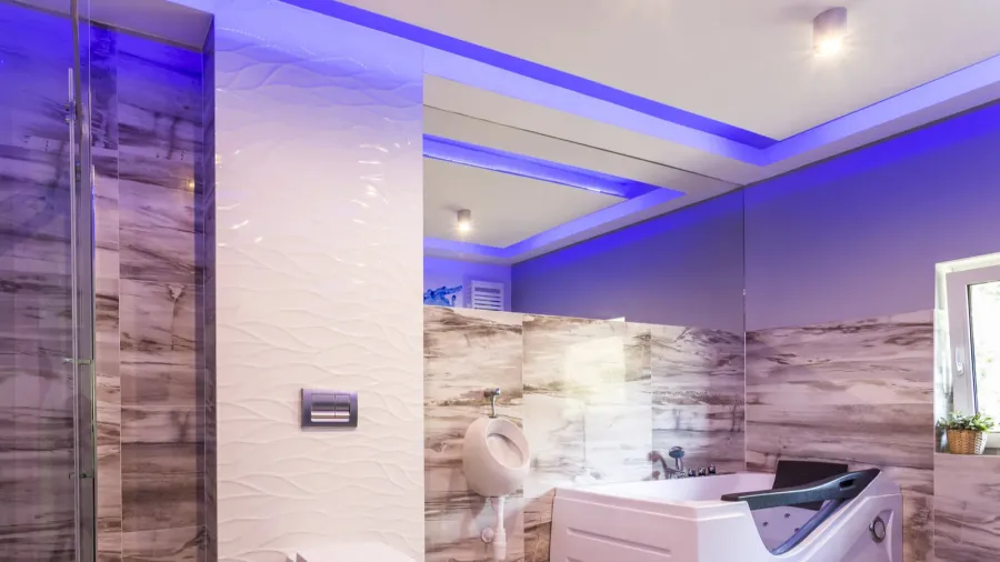 bathroom with marble tiles and glass shower cabin