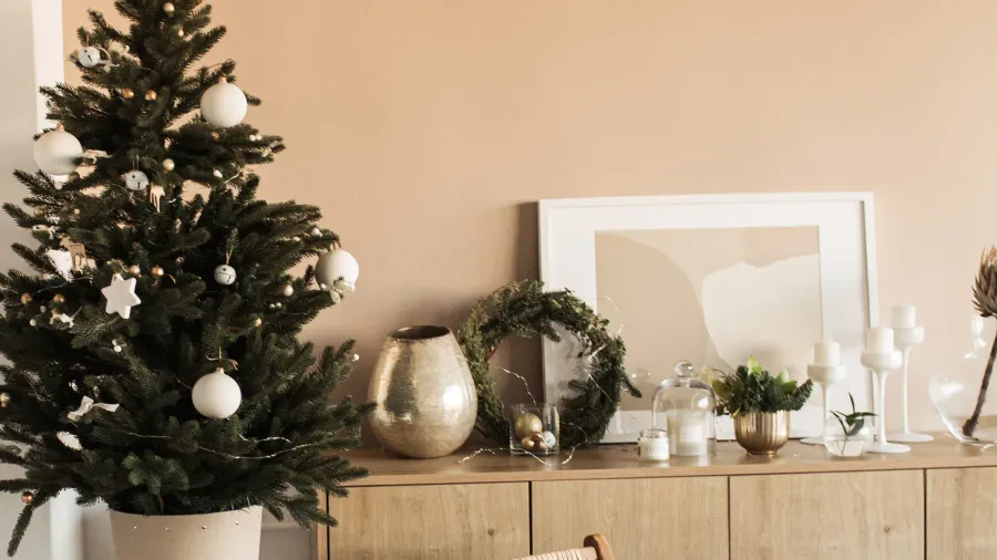 beautiful christmas tree with toys baubles and homemade paper gift