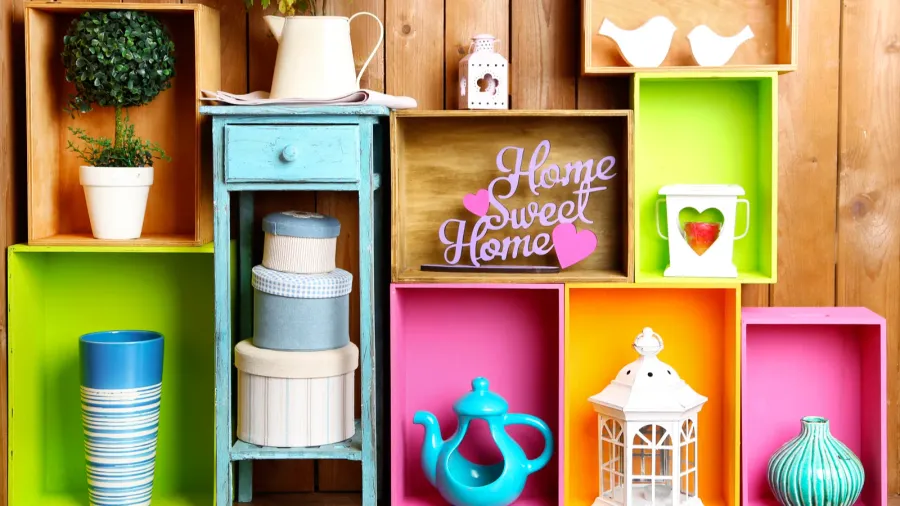 beautiful colorful shelves with different home related objects on wooden