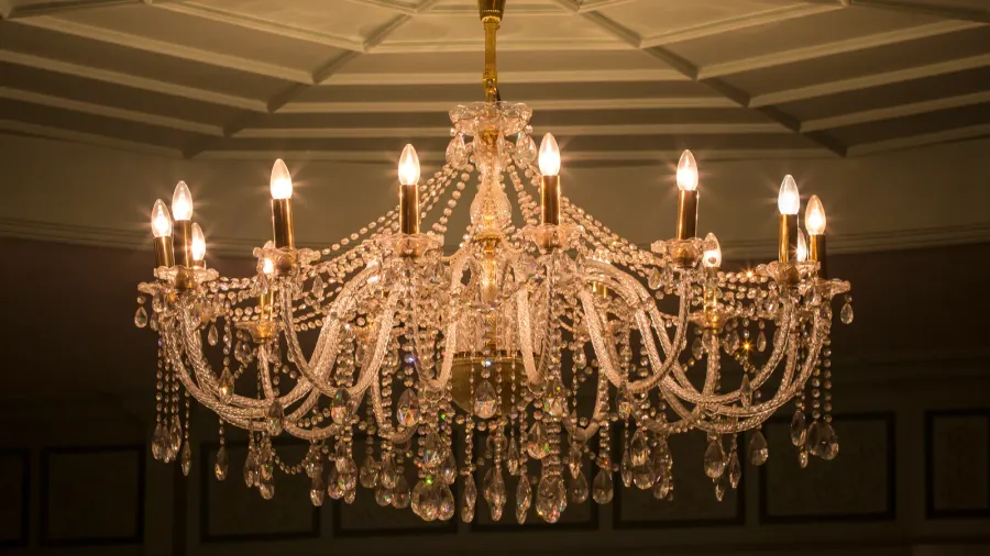 An elegant chandelier adorned with crystals and lights.