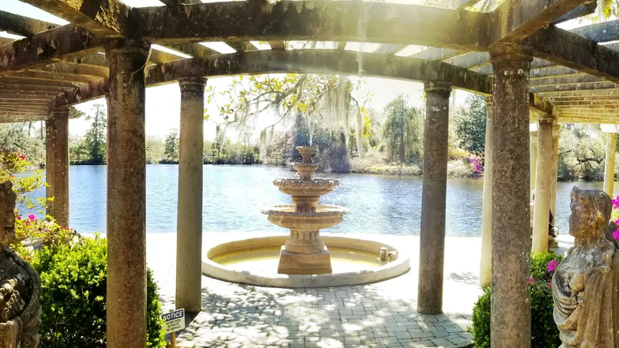 beautiful fountain and trellis on the lake in airlie gardens