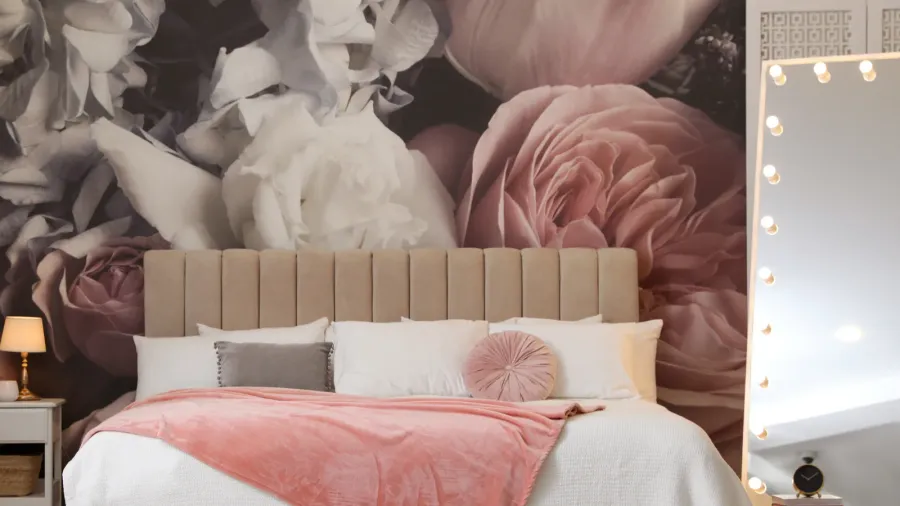 beautiful room interior with large bed mirror and floral pattern