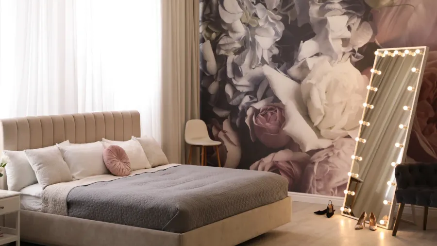 beautiful room interior with large bed mirror and floral pattern