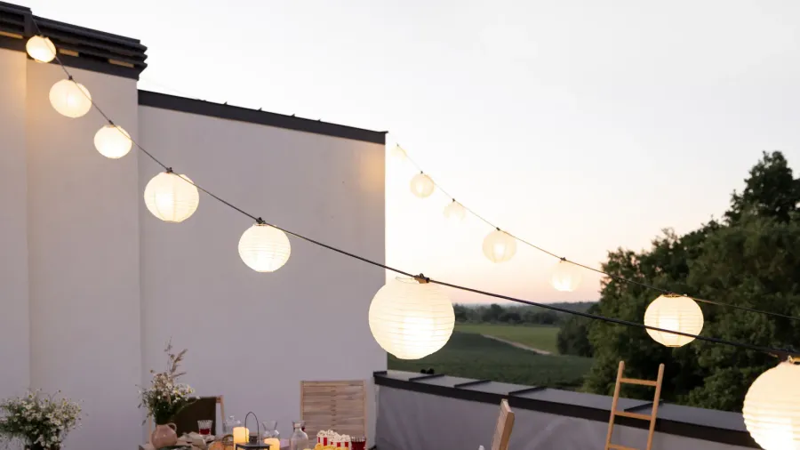 beautifully decorated roof terrace with a dining table