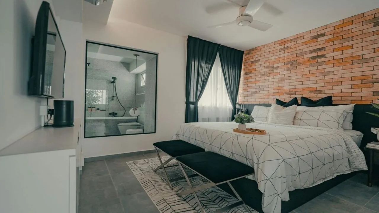 An exposed brick accent wall adds rustic charm and architectural interest to your bedroom.