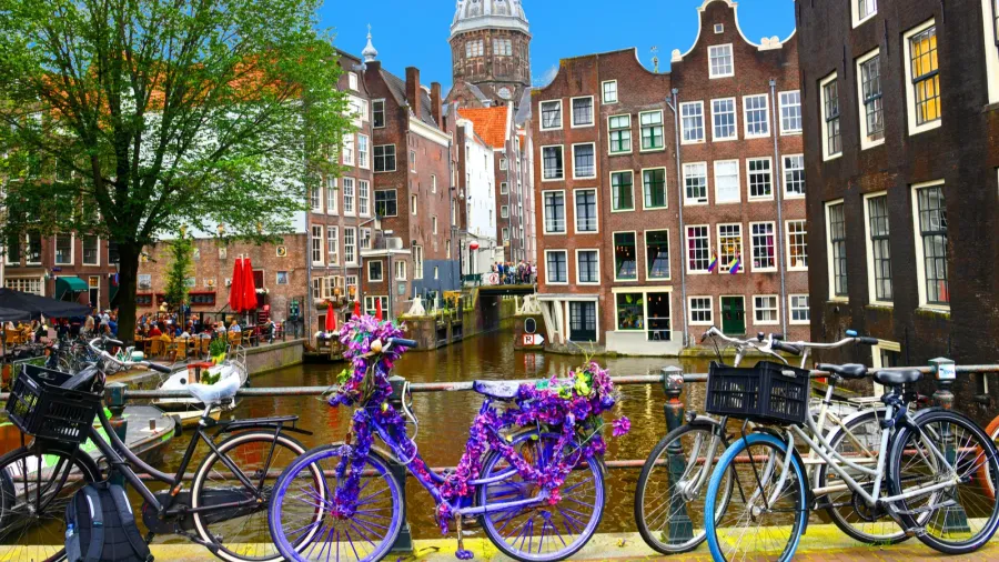 bicycles over canal amsterdam city picturesque landscape in the nitherlands
