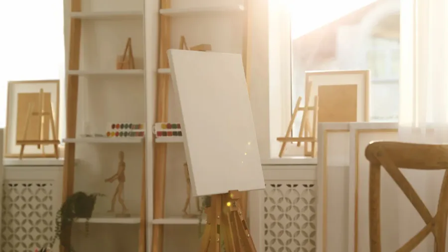 blank canvas on easel in art studio