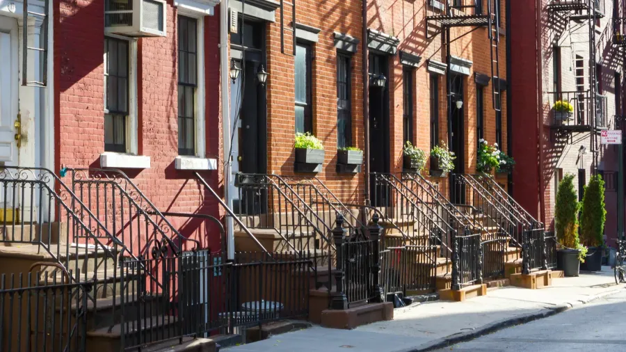 block of historic buildings on gay street in new york