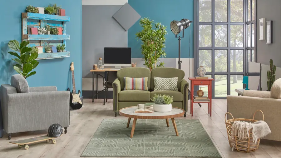 blue and grey wall background green furniture sofa and armchair