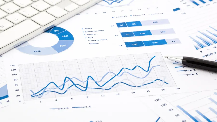 blue graph and chart reports on office table