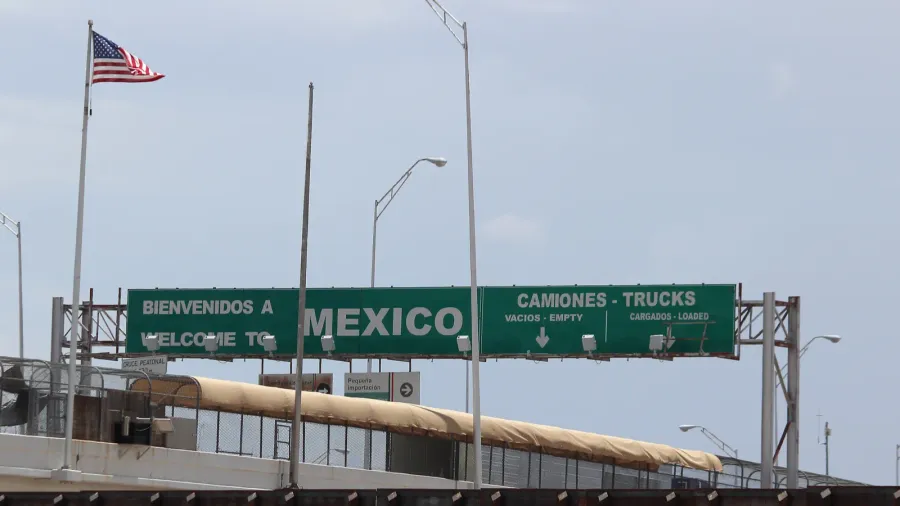 border of mexico and the united states with flags and