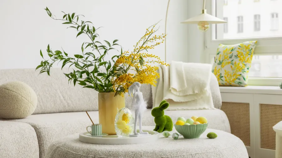 bright living room with an easter setup featuring yellow tulips