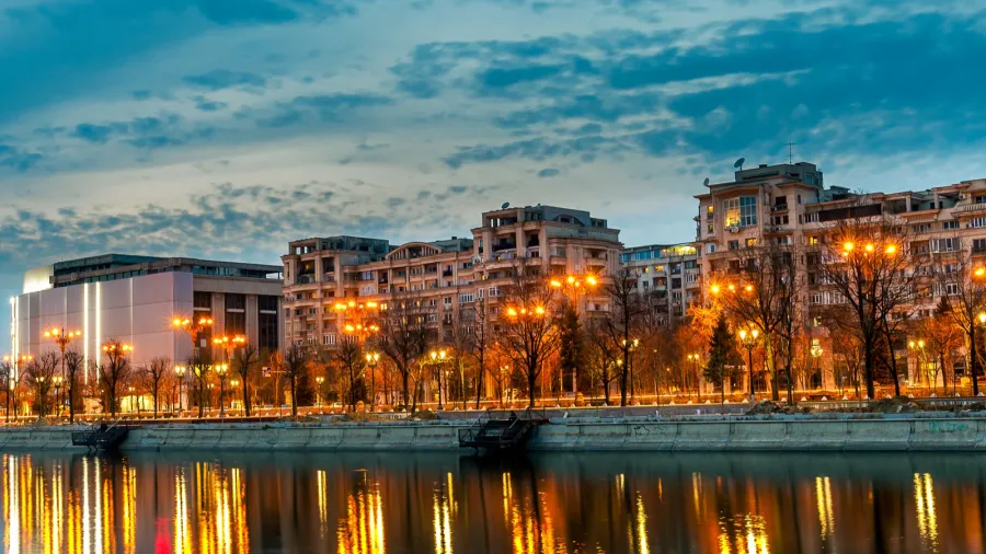 bucharest city center splaiul unirii at dusk dambovita river