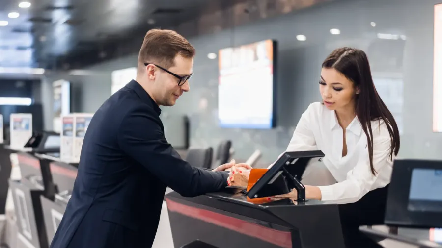 business trip handsome young businessman in suit holding his passport