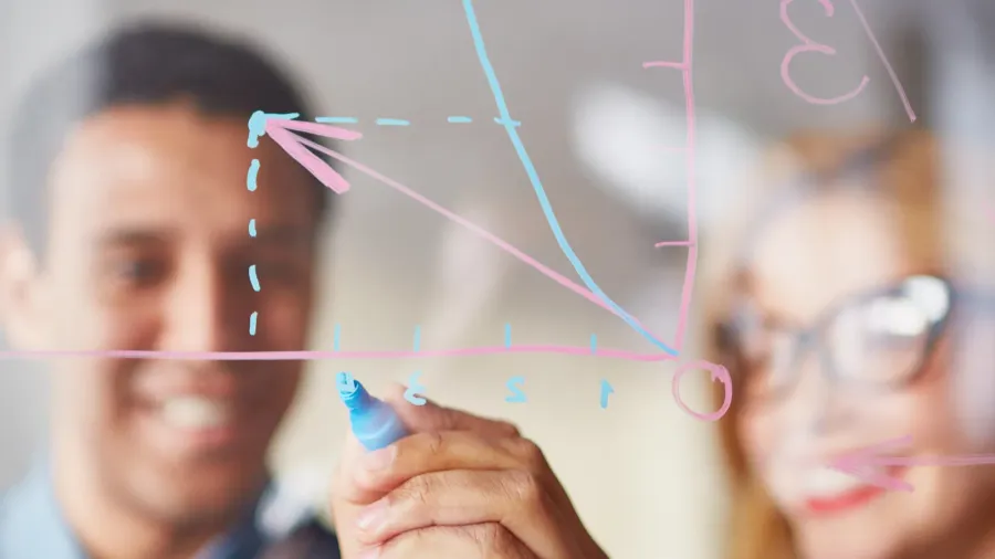 businessman sketching graph