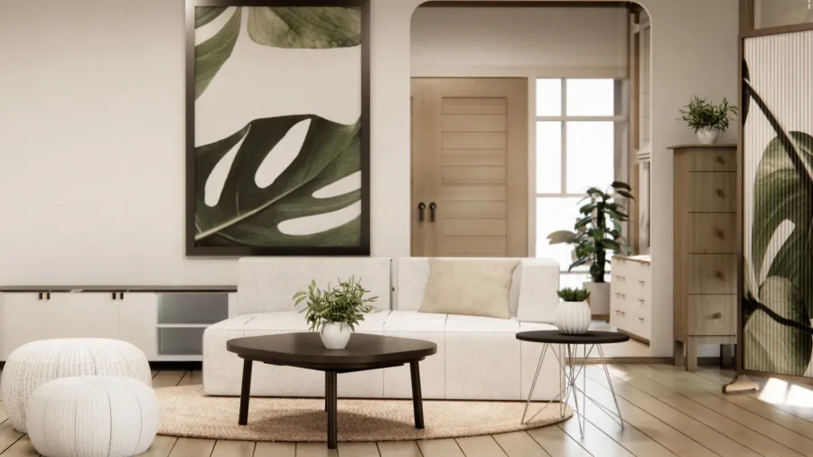 A modern living area features a sleek couch, light colors, and a large leaf motif artwork.