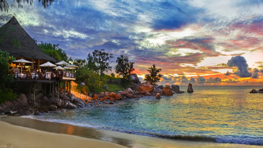cafe on tropical beach at sunset