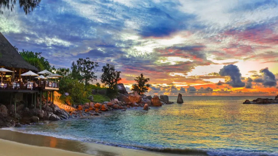 cafe on tropical beach at sunset