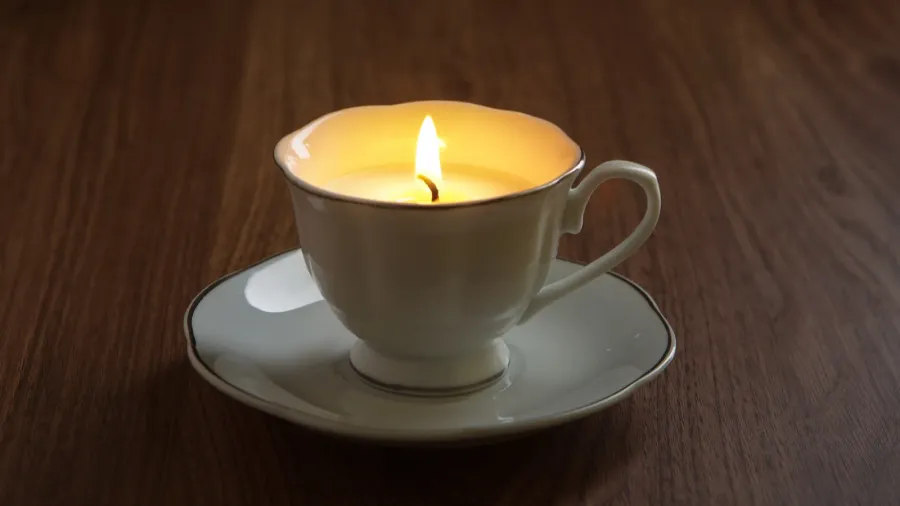 candle in a tea cups