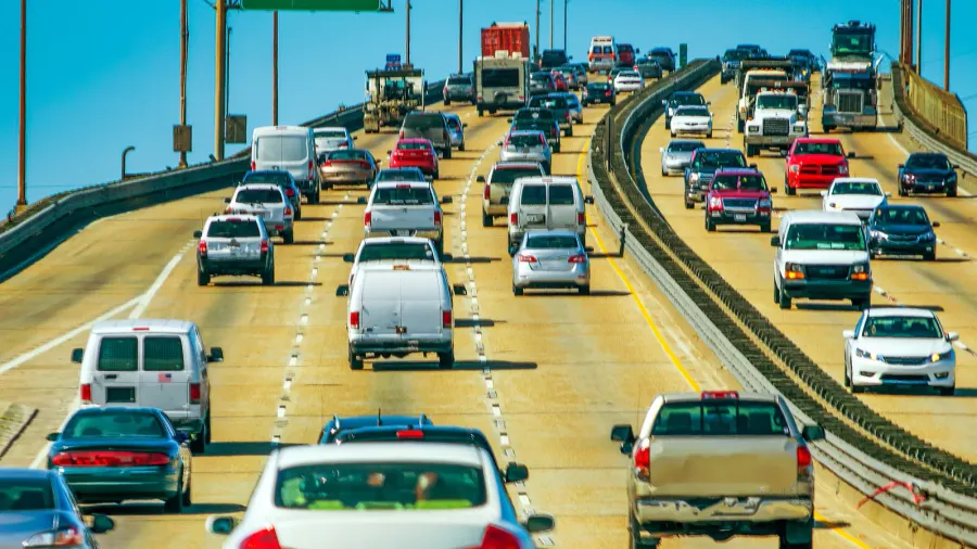 car traffic over a major bridge empty road signs on