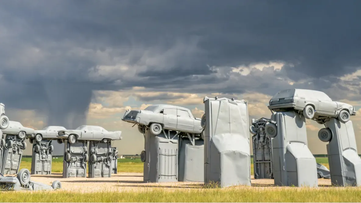 famous car sculpture created by Jim Reinders, a modern replica of England's Stonehenge using old cars.