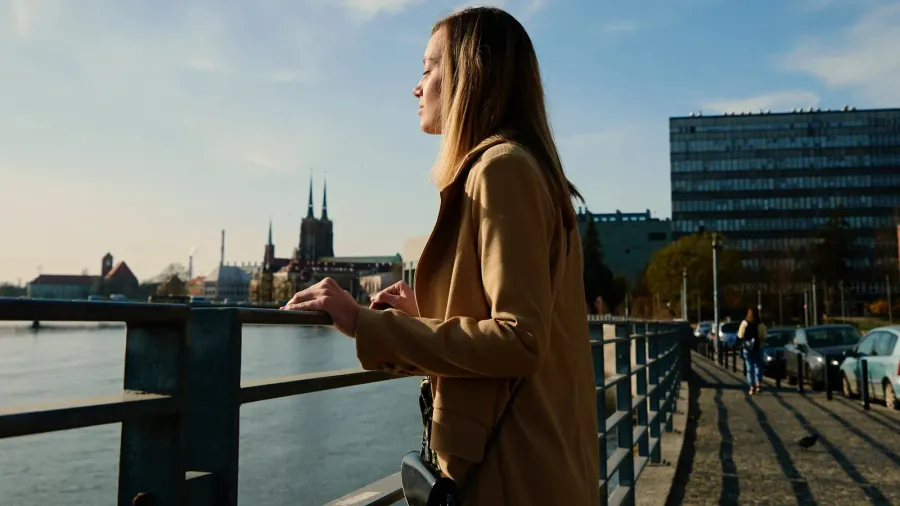 cheerful woman walks at europe city street