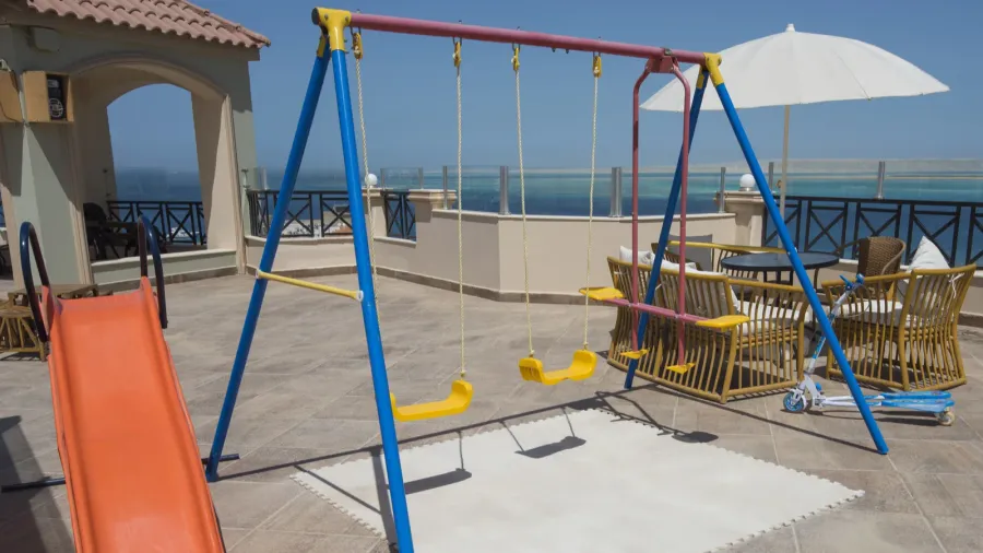 childrens play area on roof terrace with sea view