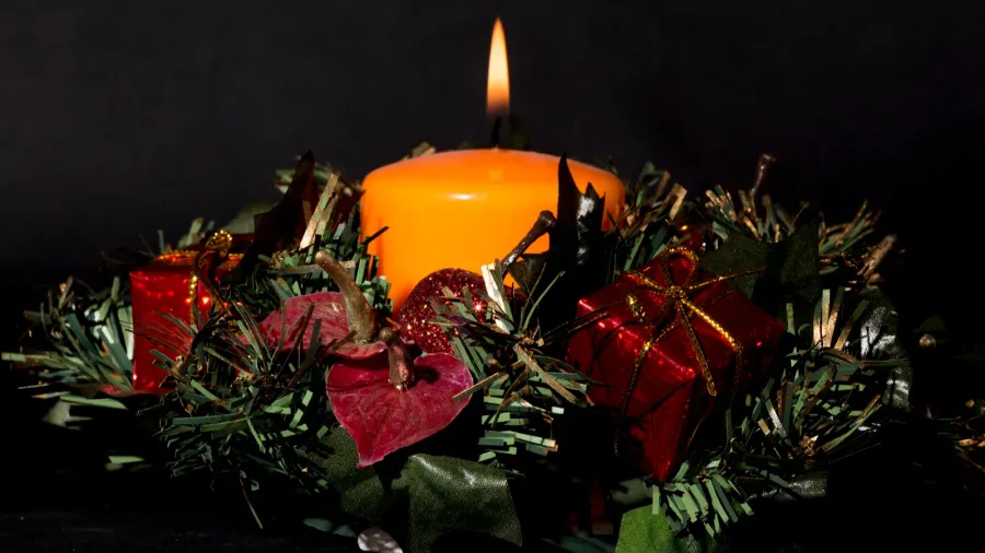 christmas centerpiece with a lit candle