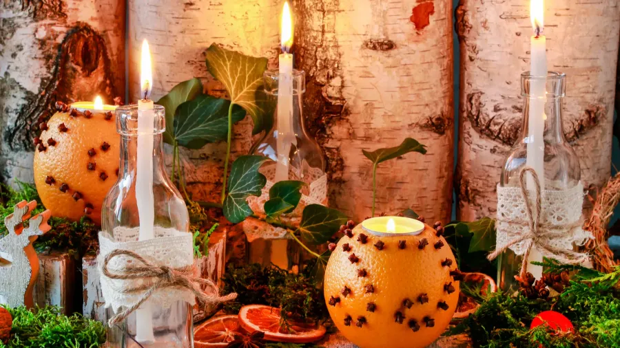 christmas home decoration with pomander candles moss and parad
