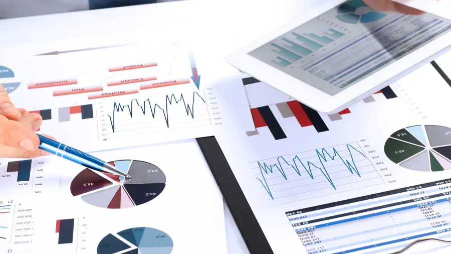 closeup of businessman analyzing graphs on a digital tablet