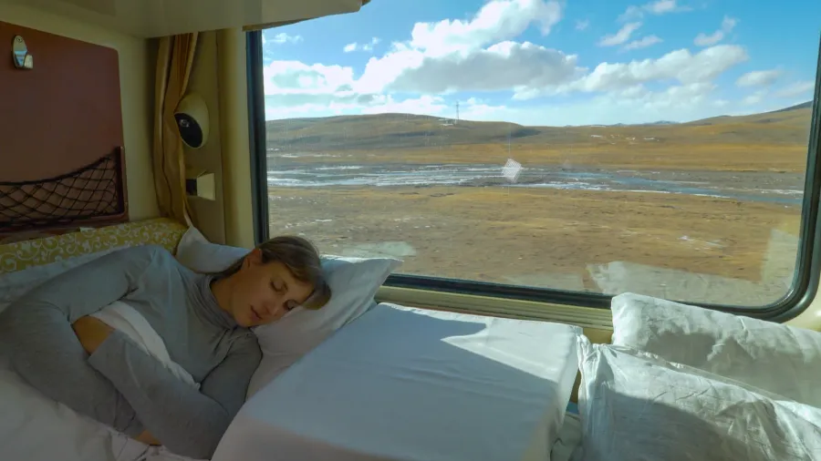 close up tired girl sleeps in her sleeper cabin during