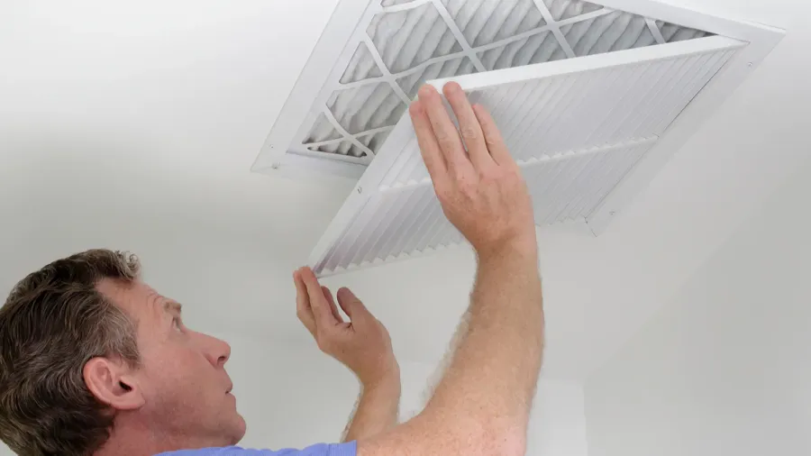 closing grill after replacing air filterman shutting grill of hvac