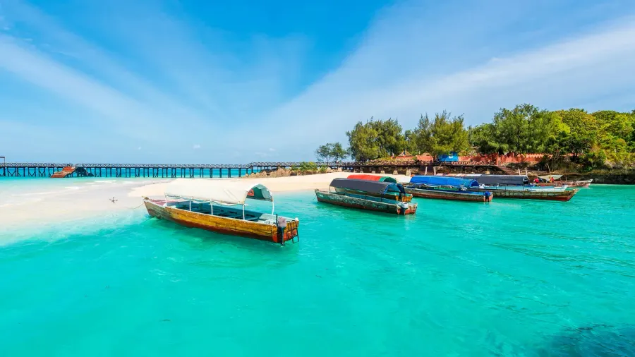 colorful seascape with boats near zanzibar shore