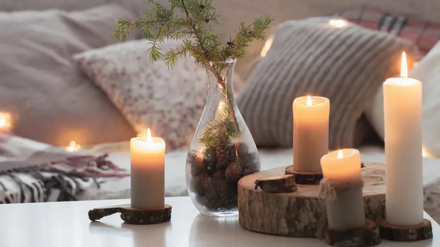 composition of candles on white table against the background