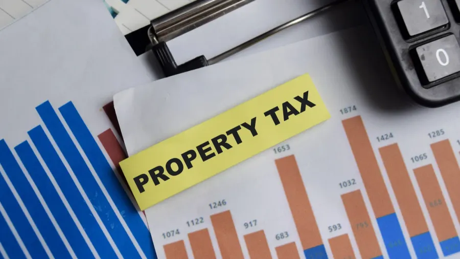 concept of property tax write on sticky notes isolated on