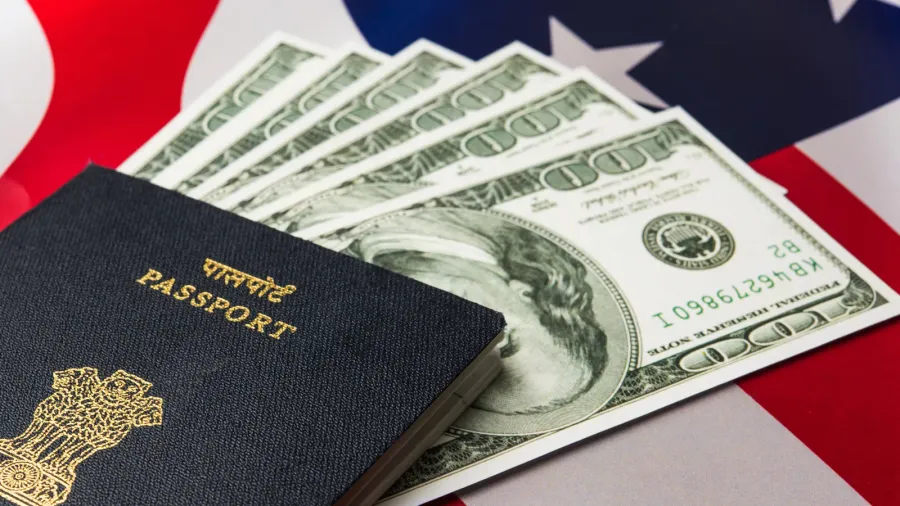 concept showing indian passport with us currency notes or dollars